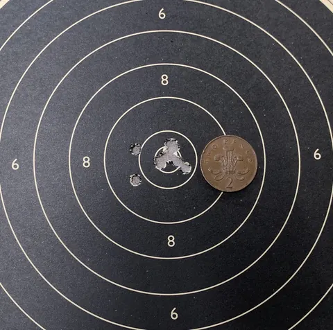 Ten-shot rifle group on a paper target